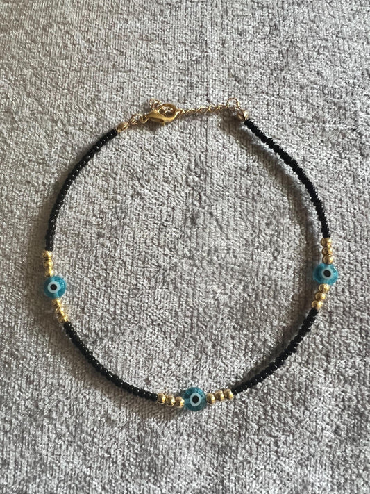 Black bead, Anklet, evil eye, summer beach. Add a touch of glamour with this lightweight ankle bracelet with an evil eye charm