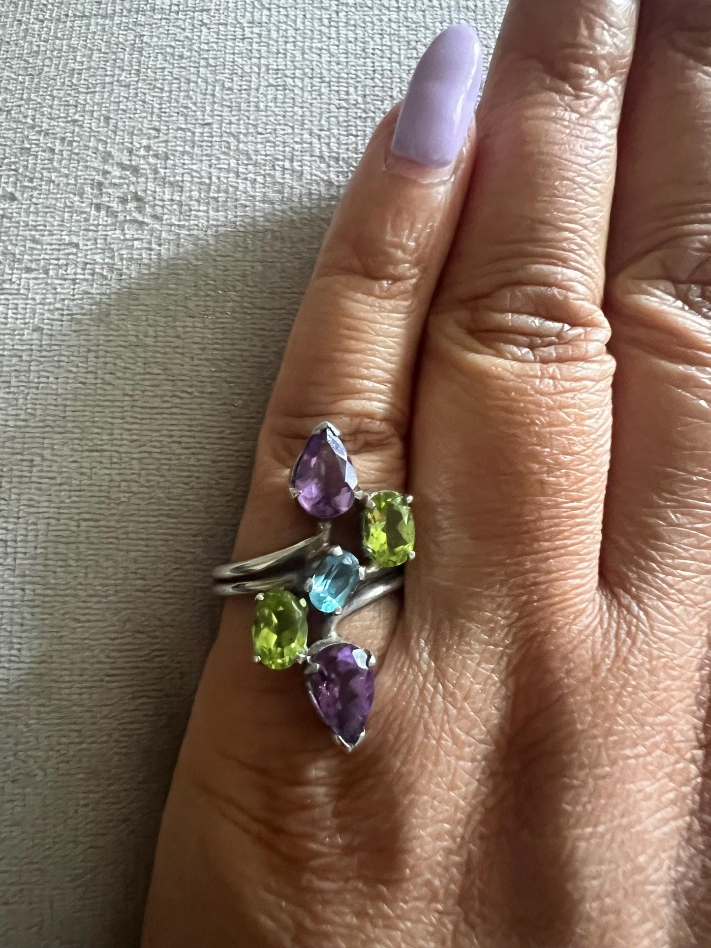 Silver ring with gemstones, amethyst, garnet, peridot and blue topaz