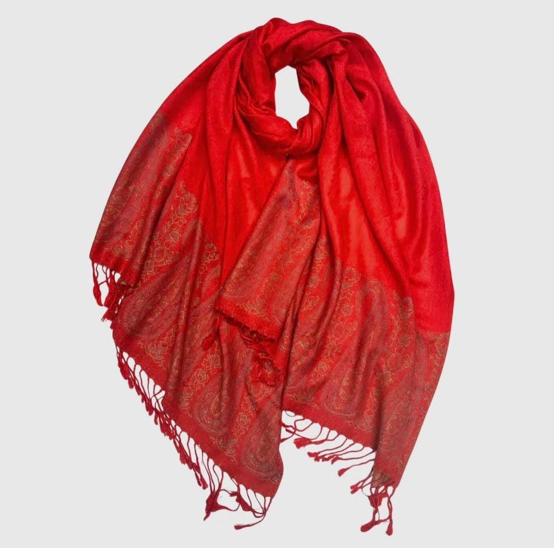 Pashmina/wrap/shawl with a beautiful paisley self print and a paisley border and fringe