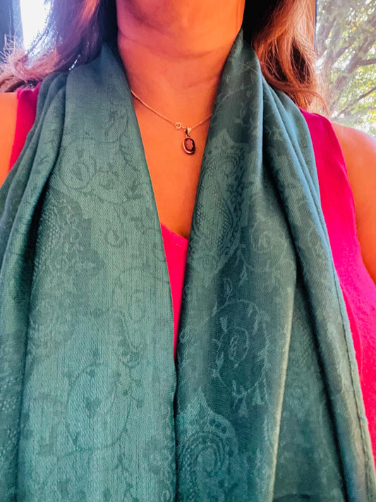 Pashmina/wrap/shawl with a beautiful paisley self print and a paisley border and fringe