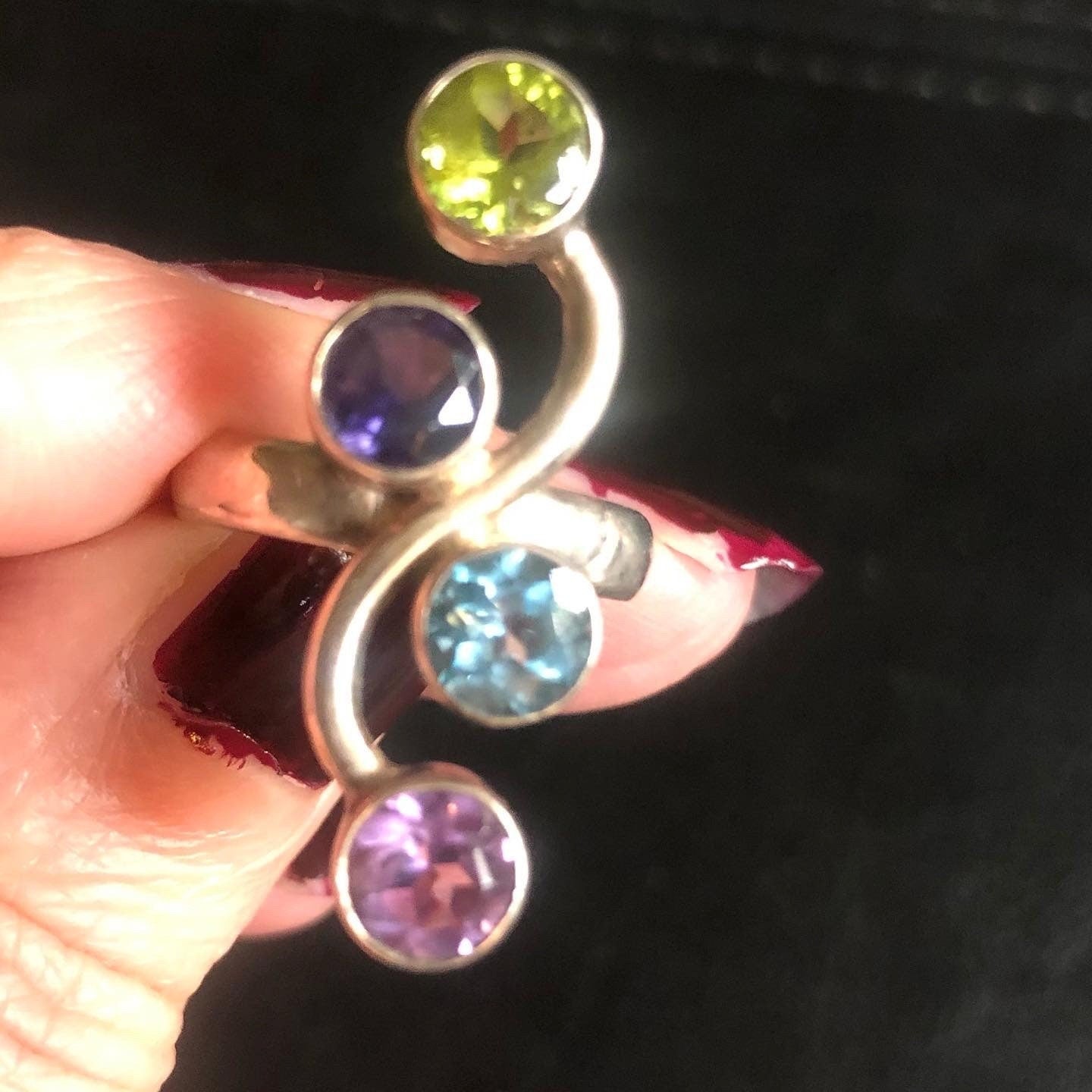 Silver ring with gemstones, amethyst, garnet, peridot and blue topaz