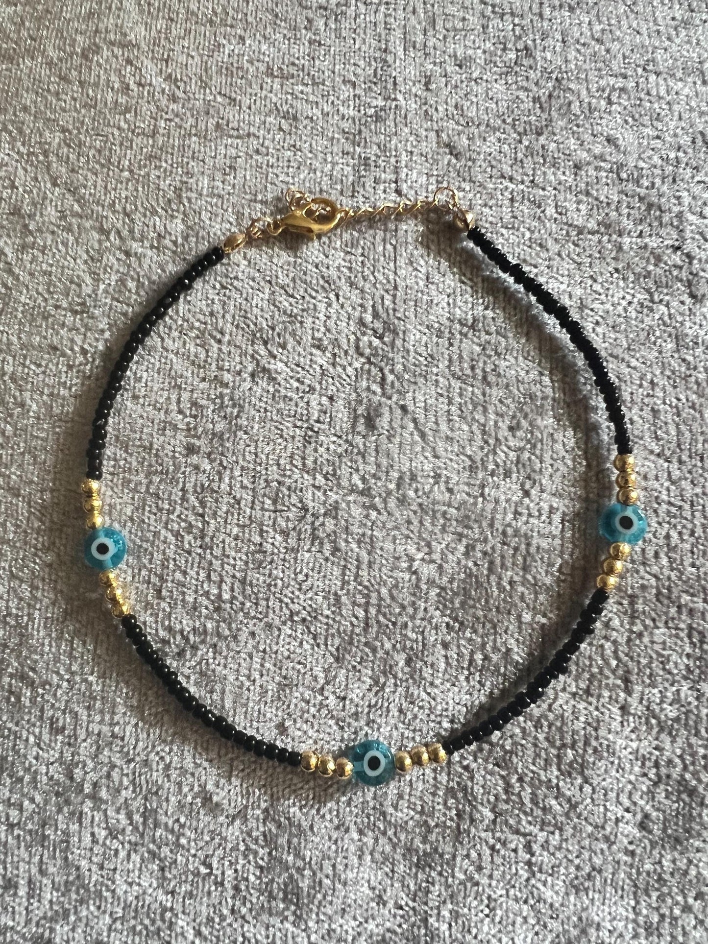 Black bead, Anklet, evil eye, summer beach. Add a touch of glamour with this lightweight ankle bracelet with an evil eye charm