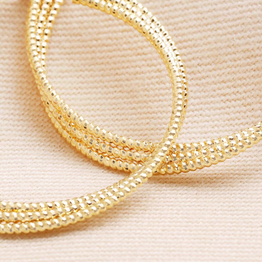 Dotted Triple Twisted Hoop Earrings In Gold