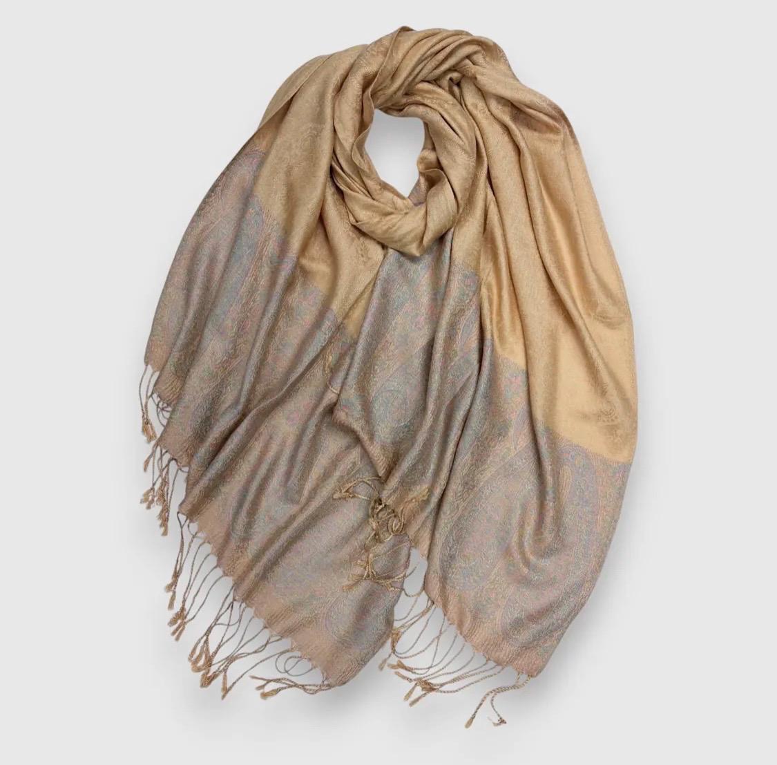 Pashmina/wrap/shawl with a beautiful paisley self print and a paisley border and fringe
